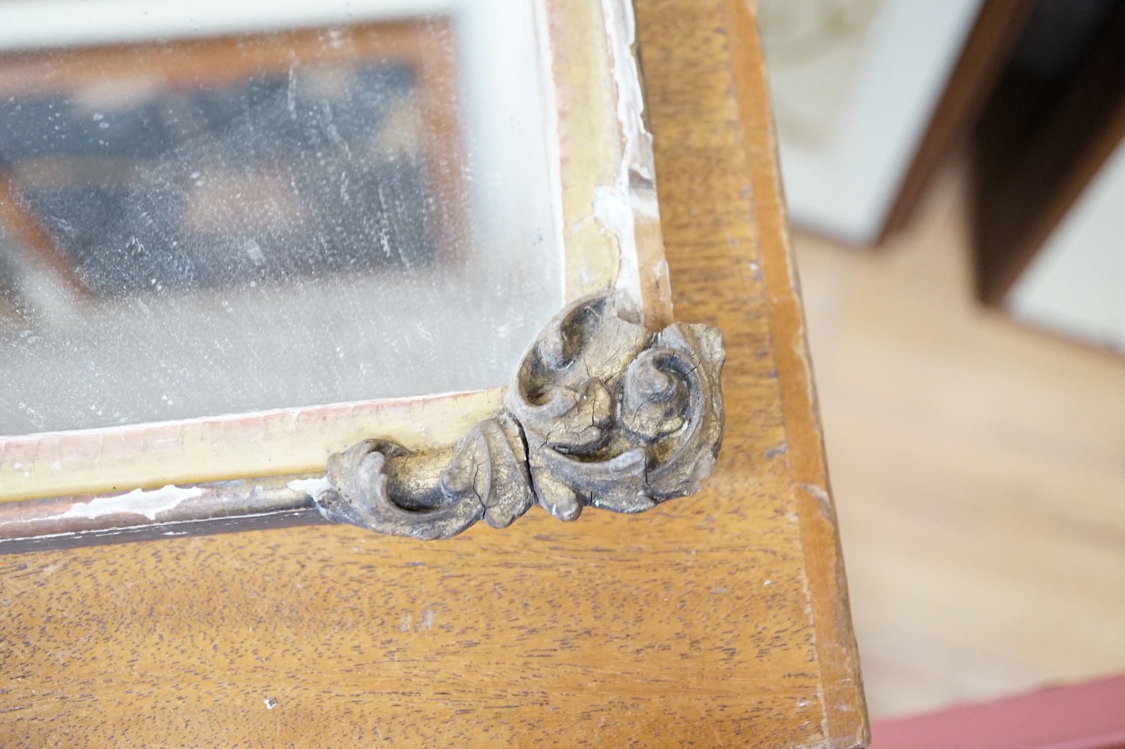 A gilt wooden mirror, 49cms wide, 40cm high